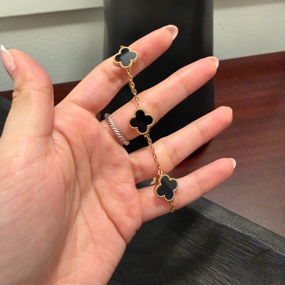 Elegant Black and Gold Clover Bracelet